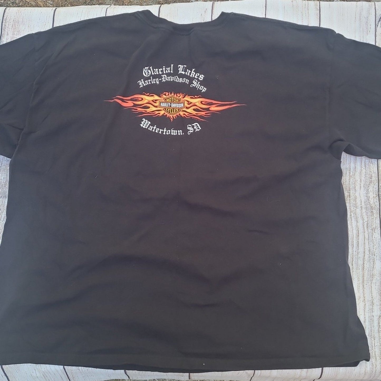 Black vintage Harley Davidson shirt with Glacial Lakes shop logo and flaming design on back