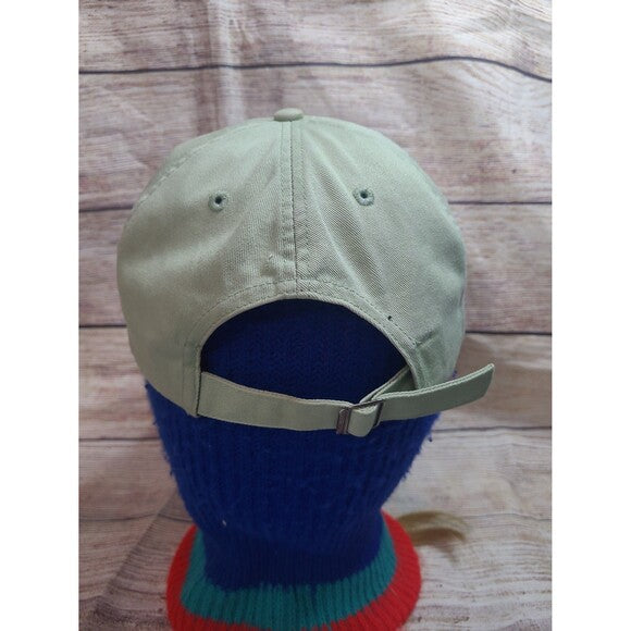 Back view of vintage 90s Nike snapback with adjustable strap displayed on blue mannequin head