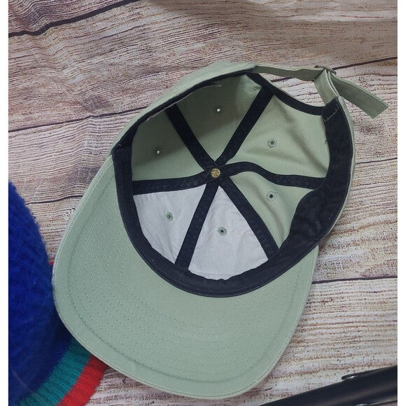 Inside view of a vintage 90s Nike snapback cap showing adjustable strap and black inner lining