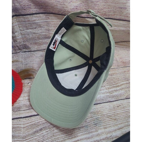 Inside view of vintage 90s Nike snapback hat in light green with black and white interior panels
