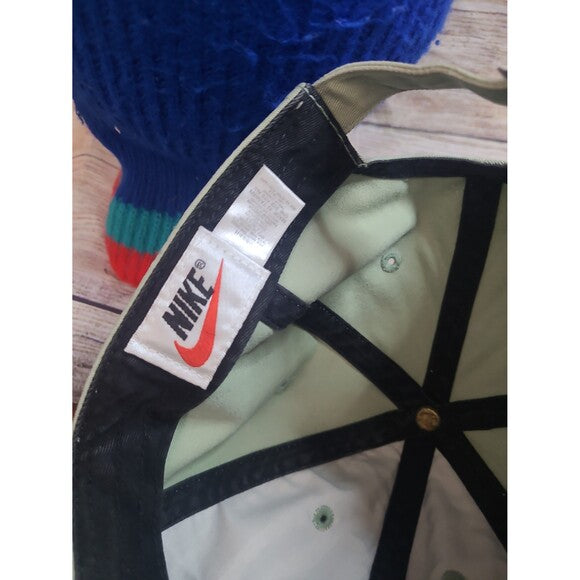 Inside view of vintage 90s Nike snapback showing Nike logo and adjustable strap from RetroVintage Thrift