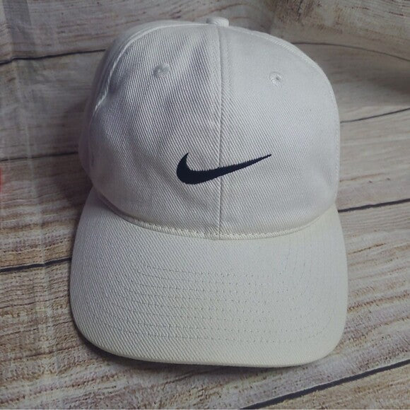 White tag Nike cap 90s with black swoosh logo vintage style from RetroVintage Thrift