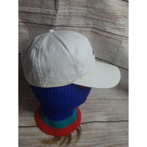 White tag Nike cap 90s style vintage hat displayed on blue red and green mannequin head