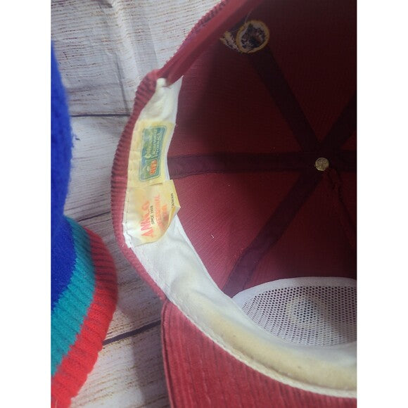 Inside view of Washington Redskins vintage corduroy hat showing labels and red fabric interior