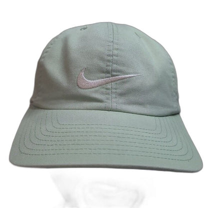 Green vintage 90s Nike snapback cap with white embroidered Nike swoosh logo